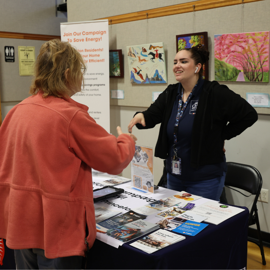 two people chatting during a tabling event